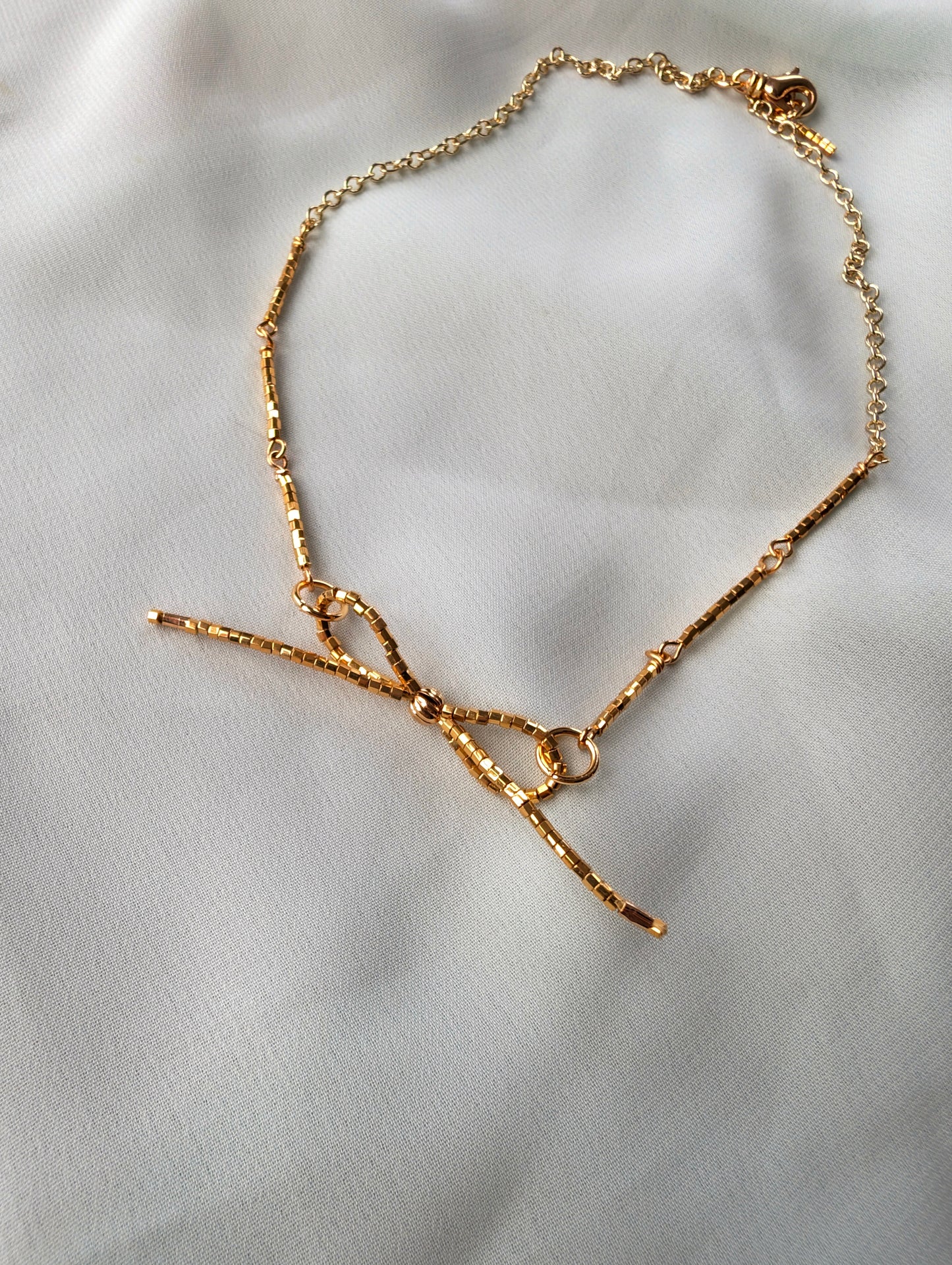 Liquid Gold - Single Bow 15 inch Choker Necklace - 24k Gold Plated Hex-cut Beads